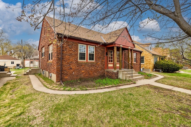 5028-5030 Nicollet Ave S, Minneapolis, MN 55419 - view of front of home featuring brick siding, a shingled roof, and a front lawn