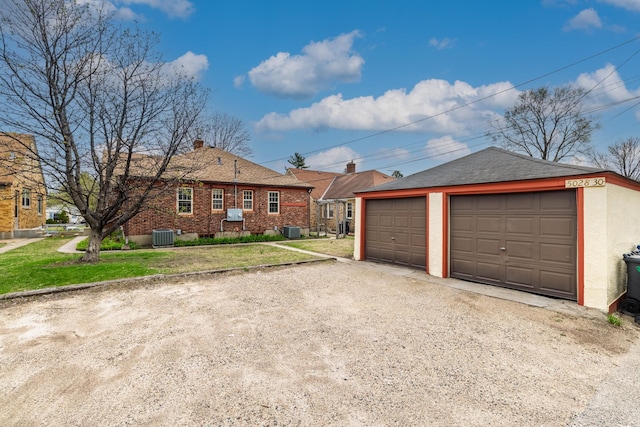 5028-5030 Nicollet Ave S, Minneapolis, MN 55419 - ranch-style home featuring a garage, an outbuilding, central air condition unit, and a front yard
