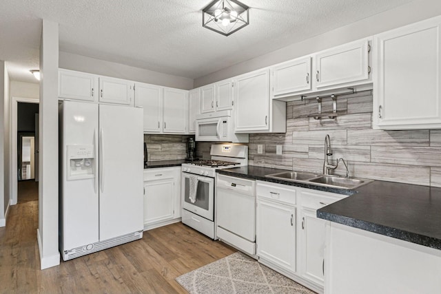 2313 122nd St, Burnsville, MN 55337 - kitchen with white appliances, a sink, white cabinets, and a textured ceiling