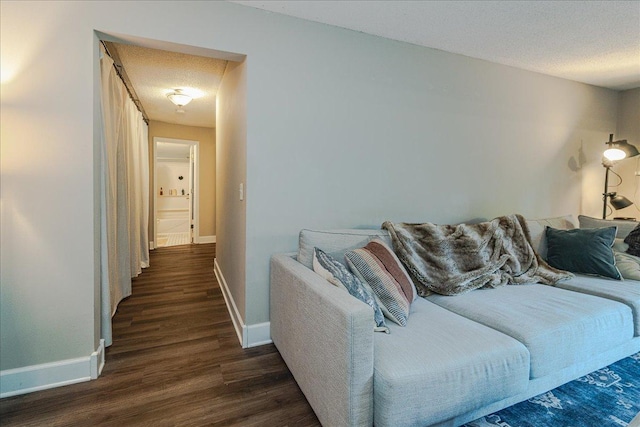 4524 Cedar Lake Rd S Unit 3, Saint Louis Park, MN 55416 - living room with dark wood-style flooring, baseboards, and a textured ceiling