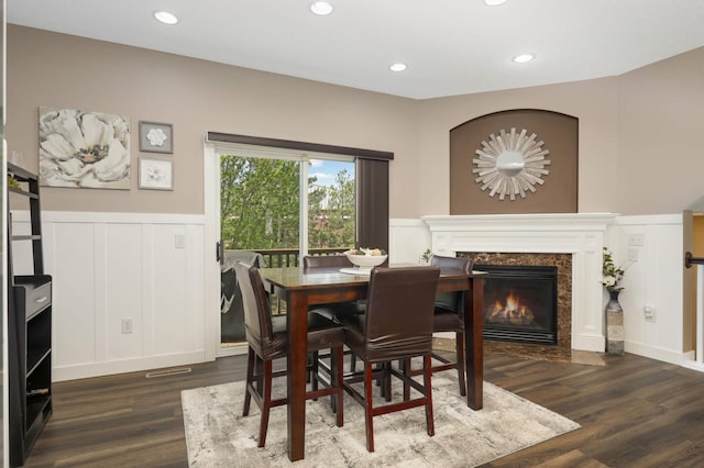 4323 Victor Path Unit 1, Hugo, MN 55038 - dining room with a decorative wall, a wainscoted wall, dark wood-style floors, a fireplace, and recessed lighting