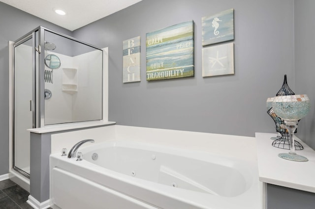 4323 Victor Path Unit 1, Hugo, MN 55038 - full bath featuring a shower stall, a jetted tub, and recessed lighting
