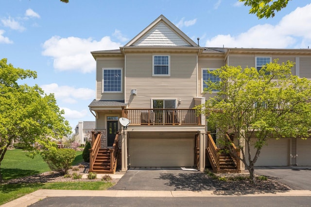 4323 Victor Path Unit 1, Hugo, MN 55038 - view of front of home with stairs, an attached garage, and asphalt driveway