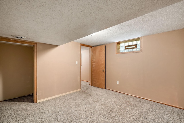 2911 California St NE, Minneapolis, MN 55418 - basement with a textured ceiling, carpet, and baseboards