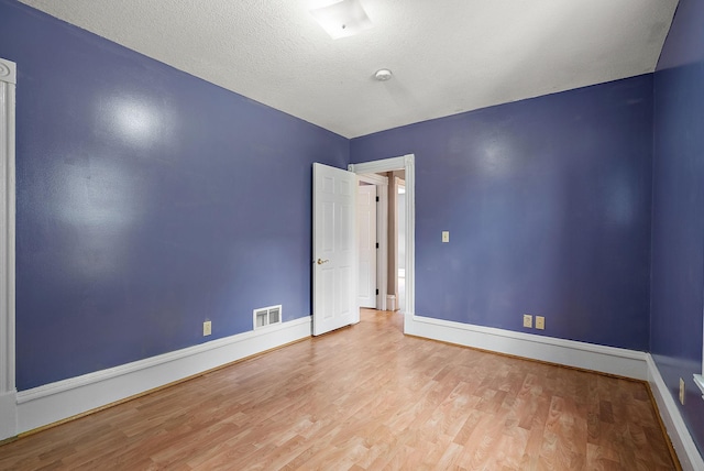 2911 California St NE, Minneapolis, MN 55418 - empty room featuring wood finished floors and baseboards