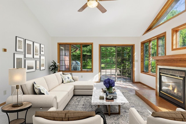 1031 Pheasant Trl, Hudson, WI 54016 - living room with healthy amount of natural light, baseboards, a high end fireplace, a ceiling fan, and high vaulted ceiling