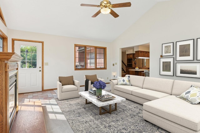 1031 Pheasant Trl, Hudson, WI 54016 - living room with ceiling fan, baseboards, and high vaulted ceiling