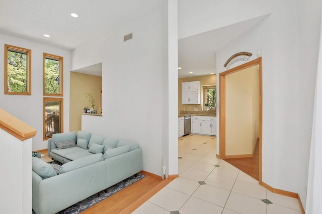12625 Tiffany Ct, Burnsville, MN 55337 - living area with recessed lighting, baseboards, and light tile patterned floors