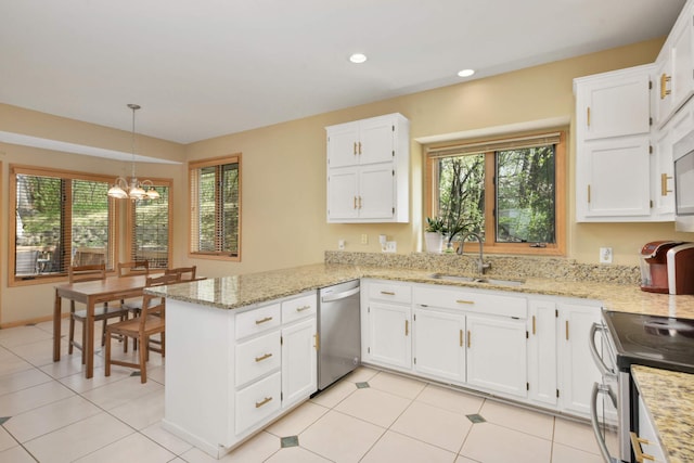 12625 Tiffany Ct, Burnsville, MN 55337 - kitchen with stainless steel appliances, a sink, a peninsula, a chandelier, and healthy amount of natural light