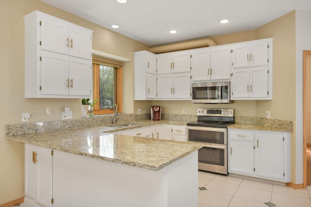 12625 Tiffany Ct, Burnsville, MN 55337 - kitchen with appliances with stainless steel finishes, a sink, a peninsula, white cabinetry, and light stone countertops