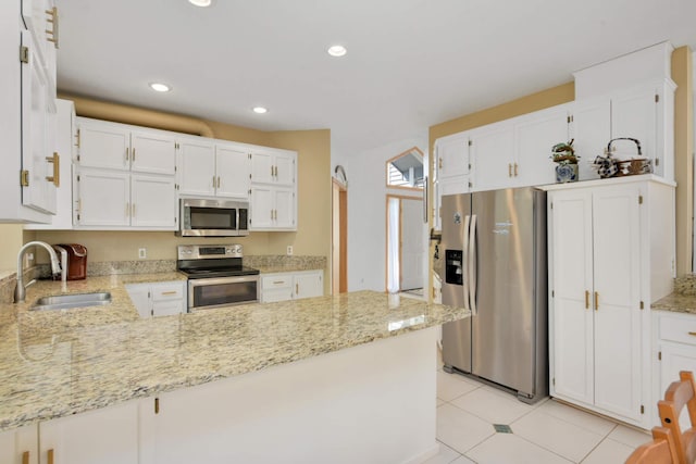 12625 Tiffany Ct, Burnsville, MN 55337 - kitchen with appliances with stainless steel finishes, a sink, a peninsula, white cabinetry, and recessed lighting