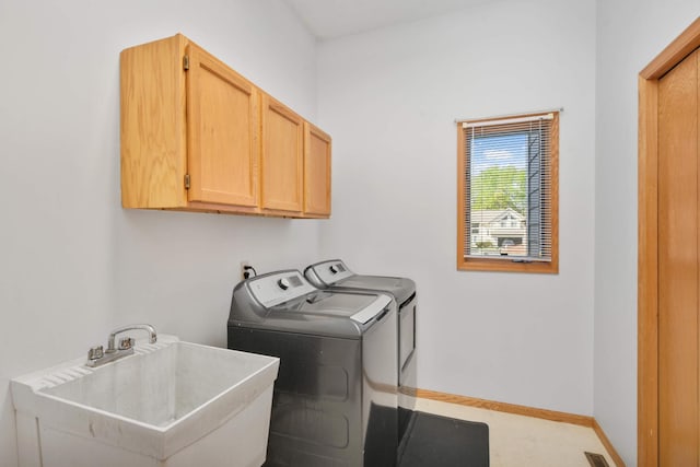 12625 Tiffany Ct, Burnsville, MN 55337 - laundry area featuring cabinet space, independent washer and dryer, and baseboards