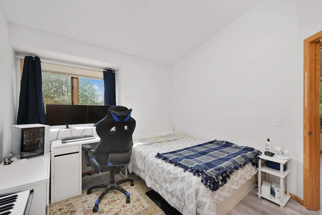 12625 Tiffany Ct, Burnsville, MN 55337 - bedroom with wood finished floors and a desk