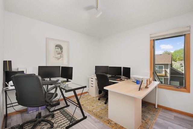 12625 Tiffany Ct, Burnsville, MN 55337 - office featuring light wood-type flooring, baseboards, and track lighting
