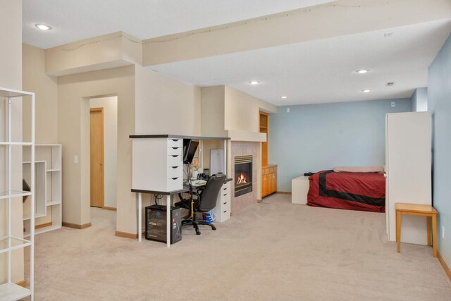 12625 Tiffany Ct, Burnsville, MN 55337 - bedroom featuring light colored carpet, baseboards, a tile fireplace, a desk, and recessed lighting