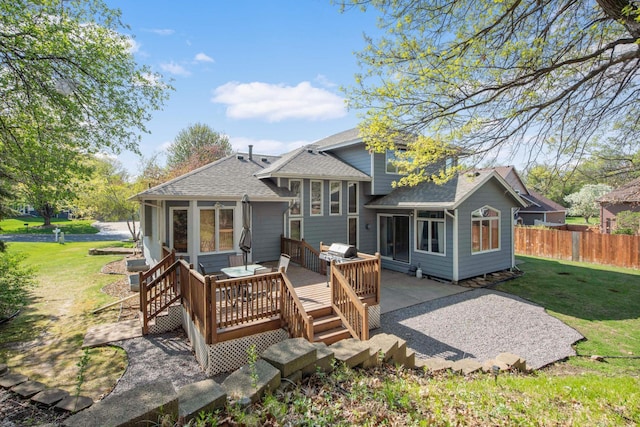 12625 Tiffany Ct, Burnsville, MN 55337 - rear view of property featuring roof with shingles and a wooden deck