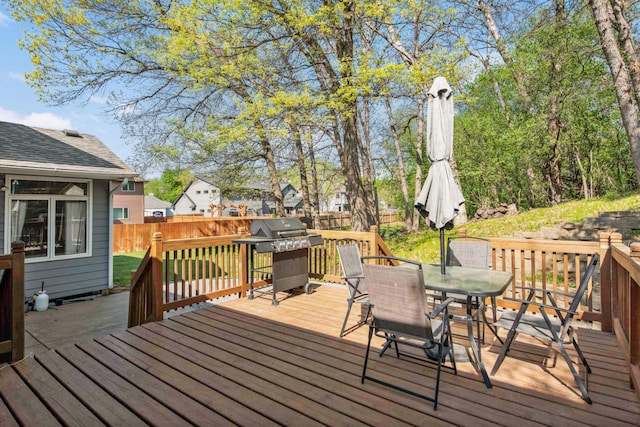 12625 Tiffany Ct, Burnsville, MN 55337 - wooden terrace with area for grilling, outdoor dining area, and fence