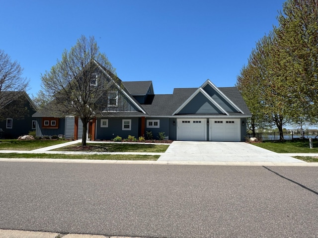 6439 Laketowne Dr, Albertville, MN 55301 - view of front facade featuring a garage, concrete driveway, and a front lawn