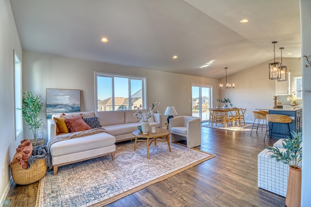 6101 Martin Ln W, West Fargo, ND 58078 - living room featuring vaulted ceiling, a chandelier, wood finished floors, recessed lighting, and baseboards