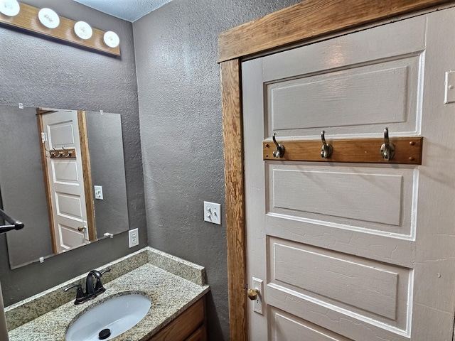 1501 Park St, Fairmont, MN 56031 - bathroom with vanity and a textured wall