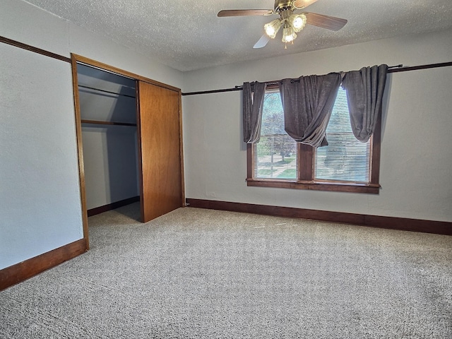 1501 Park St, Fairmont, MN 56031 - unfurnished bedroom with carpet floors, a closet, a textured ceiling, baseboards, and a ceiling fan