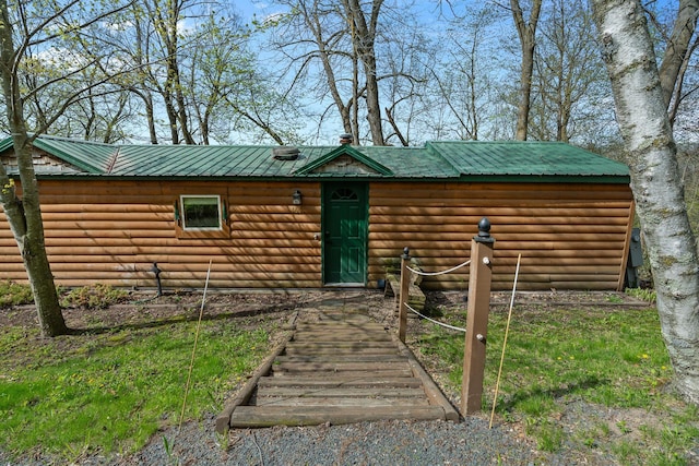 1651 Niles Ln N, Centuria, WI 54824 - rustic home featuring log veneer siding and metal roof