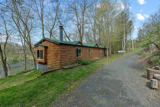 1651 Niles Ln N, Centuria, WI 54824 - view of home's exterior featuring log veneer siding