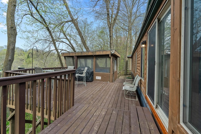 1651 Niles Ln N, Centuria, WI 54824 - wooden terrace featuring a sunroom and a grill