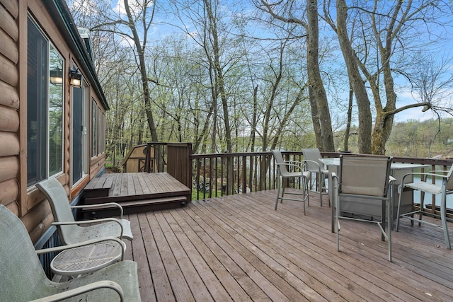 1651 Niles Ln N, Centuria, WI 54824 - wooden terrace featuring outdoor dining area