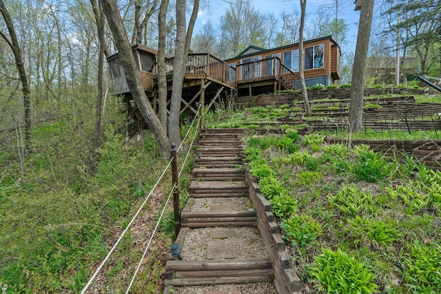 1651 Niles Ln N, Centuria, WI 54824 - rear view of property featuring stairway, a wooden deck, and fence