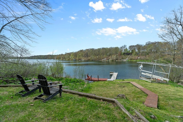 1651 Niles Ln N, Centuria, WI 54824 - dock area featuring a water view, a yard, and a forest view