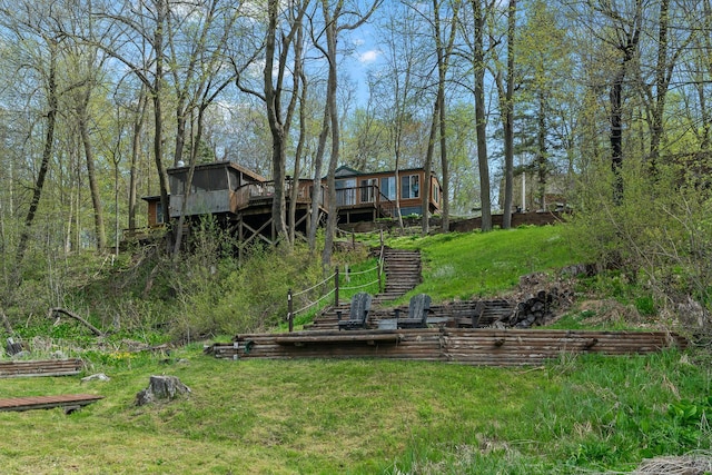 1651 Niles Ln N, Centuria, WI 54824 - view of green lawn featuring stairs and a wooden deck