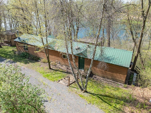 1651 Niles Ln N, Centuria, WI 54824 - view of home's exterior with metal roof and faux log siding