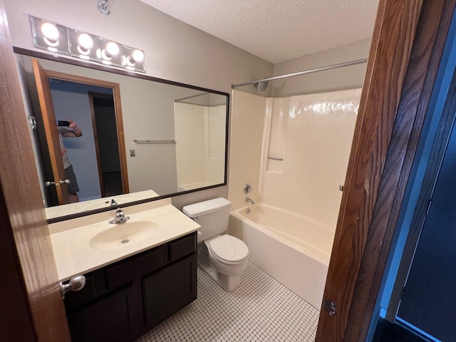 full bathroom featuring a textured ceiling, toilet, vanity, tile patterned flooring, and shower / bathtub combination