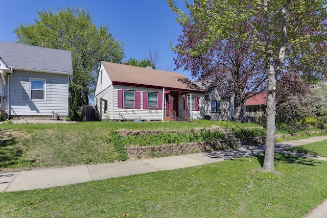 bungalow with a front lawn