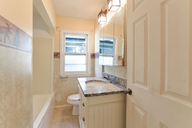 bathroom featuring toilet, tile patterned flooring, and vanity