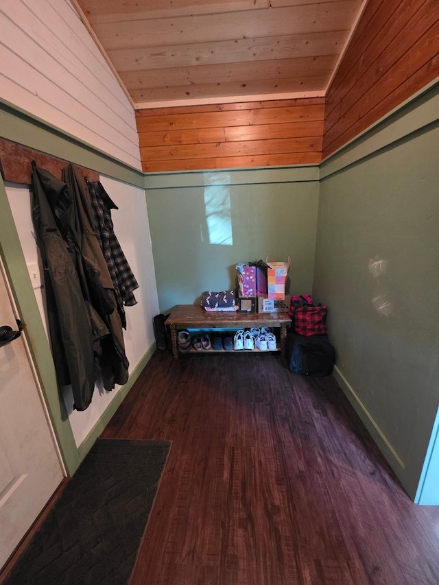 interior space with lofted ceiling, wooden ceiling, wood finished floors, and baseboards