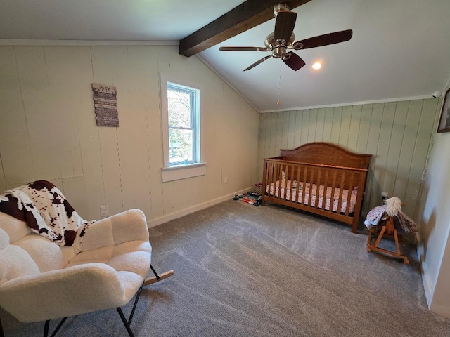 bedroom featuring a crib, carpet flooring, and ceiling fan