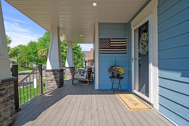 wooden terrace with a porch