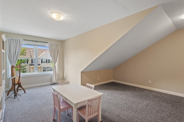 carpeted office featuring baseboards and a textured ceiling