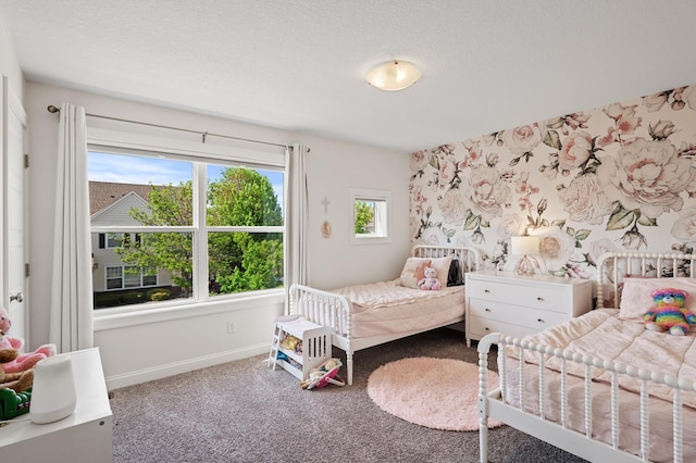 carpeted bedroom with baseboards