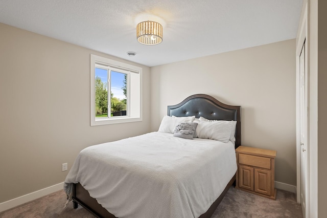 bedroom featuring carpet and baseboards