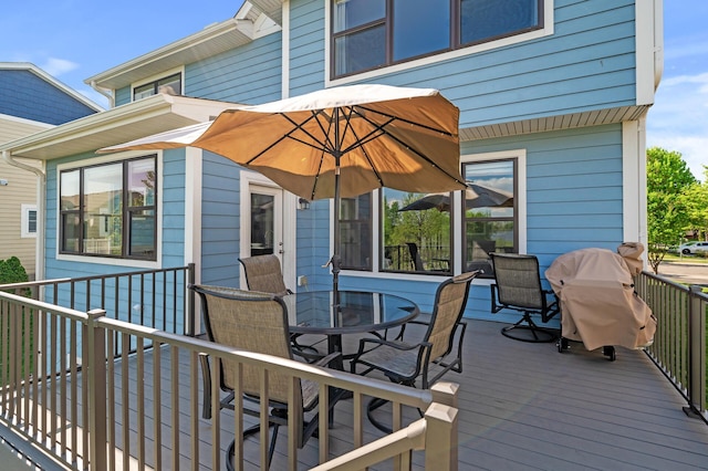 wooden terrace featuring outdoor dining area