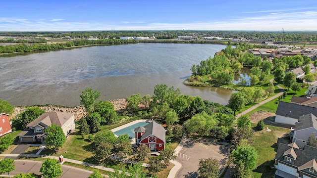 aerial view of residential area with a large body of water