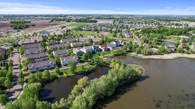 view of property location with a large body of water and nearby suburban area