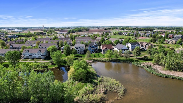 view of property location featuring nearby suburban area and a nearby body of water