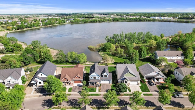 aerial perspective of suburban area with a large body of water