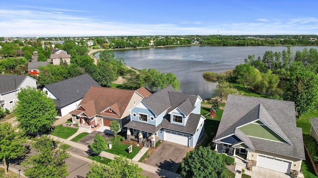 aerial view of residential area with a large body of water