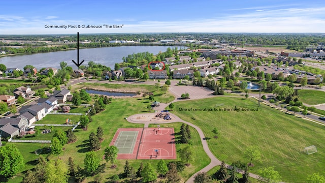 aerial view of residential area featuring a nearby body of water