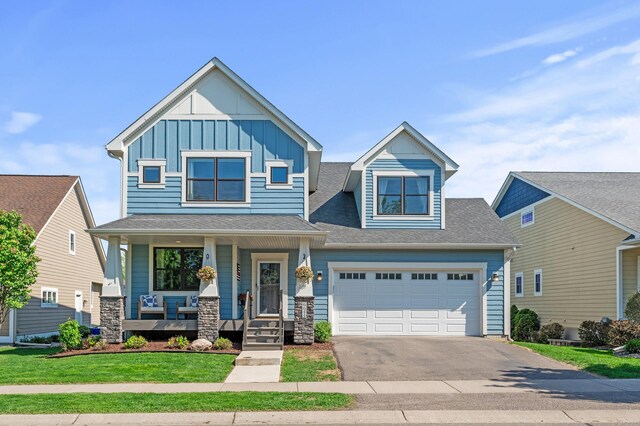 6644 Lamplight Dr, Albertville, MN 55301 - craftsman house with board and batten siding, asphalt driveway, a porch, a garage, and roof with shingles